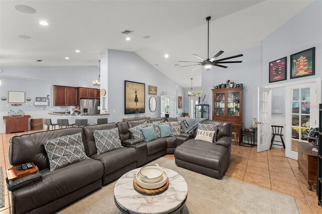 17523 Doris St, Montverde, FL 34756 - living area with high vaulted ceiling, ceiling fan, a chandelier, recessed lighting, and light tile patterned floors