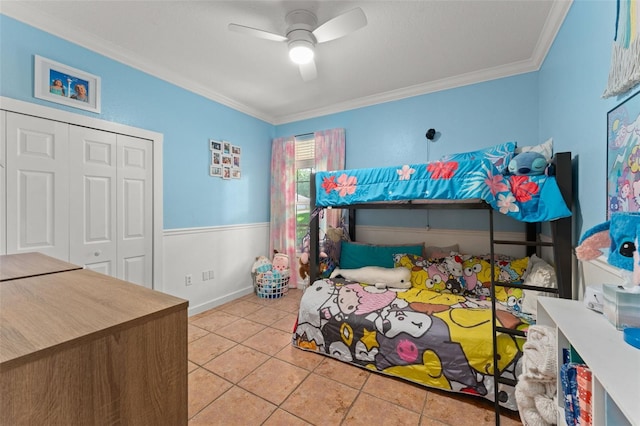 17523 Doris St, Montverde, FL 34756 - bedroom with crown molding, tile patterned flooring, a closet, ceiling fan, and baseboards