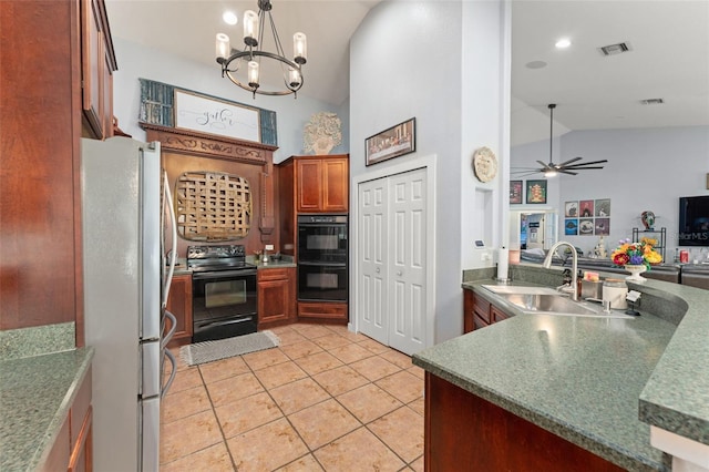 17523 Doris St, Montverde, FL 34756 - kitchen with black appliances, a sink, light tile patterned floors, open floor plan, and a chandelier