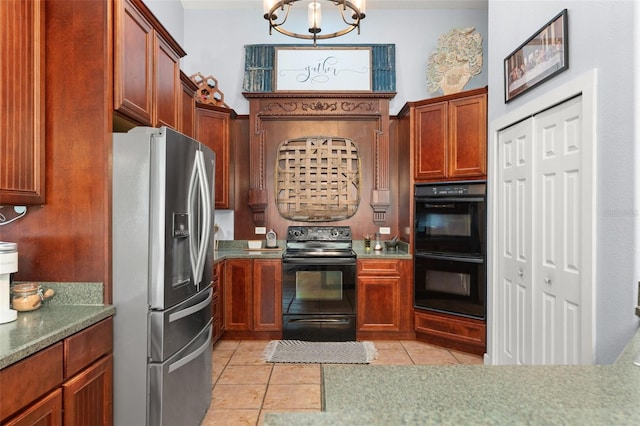 17523 Doris St, Montverde, FL 34756 - kitchen with black appliances, light tile patterned flooring, and a chandelier