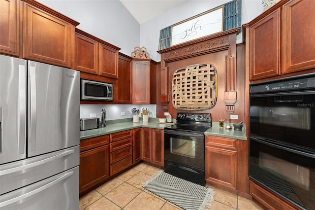 17523 Doris St, Montverde, FL 34756 - kitchen featuring black appliances, light tile patterned flooring, and high vaulted ceiling