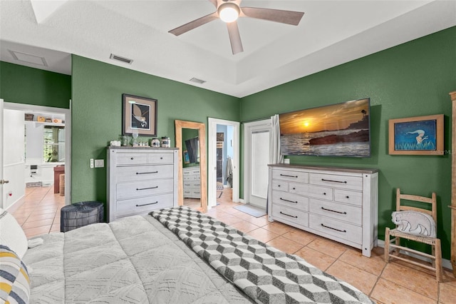 17523 Doris St, Montverde, FL 34756 - bedroom with light tile patterned floors, ensuite bathroom, and a ceiling fan