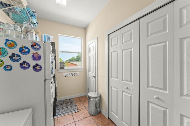 17523 Doris St, Montverde, FL 34756 - entryway with light tile patterned floors and baseboards