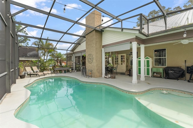 17523 Doris St, Montverde, FL 34756 - outdoor pool with a patio area, ceiling fan, a lanai, and grilling area