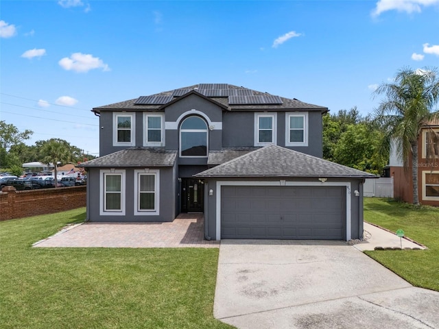 470 Regal Downs Cir, Winter Garden, FL 34787 - traditional-style home featuring concrete driveway, a garage, roof mounted solar panels, stucco siding, and roof with shingles