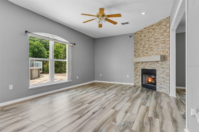 470 Regal Downs Cir, Winter Garden, FL 34787 - unfurnished living room featuring a ceiling fan, wood finished floors, a stone fireplace, baseboards, and recessed lighting