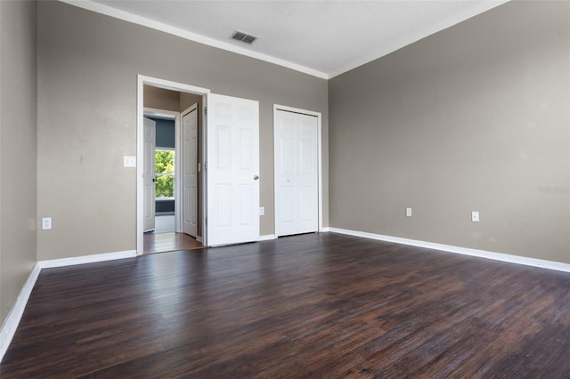 470 Regal Downs Cir, Winter Garden, FL 34787 - unfurnished bedroom with dark wood finished floors, baseboards, and crown molding