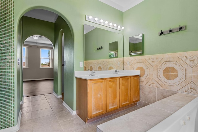 470 Regal Downs Cir, Winter Garden, FL 34787 - full bathroom featuring double vanity, tile patterned flooring, and baseboards