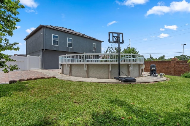 470 Regal Downs Cir, Winter Garden, FL 34787 - rear view of house with stucco siding and a wooden deck