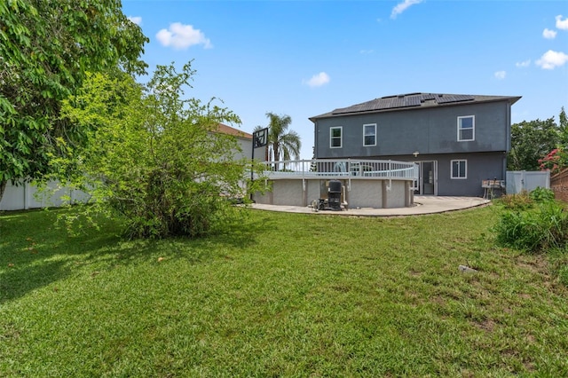 470 Regal Downs Cir, Winter Garden, FL 34787 - back of house featuring a patio area, solar panels, and stucco siding