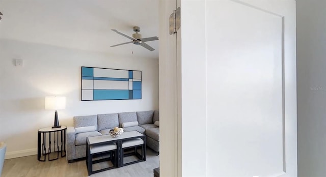 14501 Grove Resort Ave Unit 2440, Winter Garden, FL 34787 - living area with ceiling fan, light wood finished floors, and baseboards