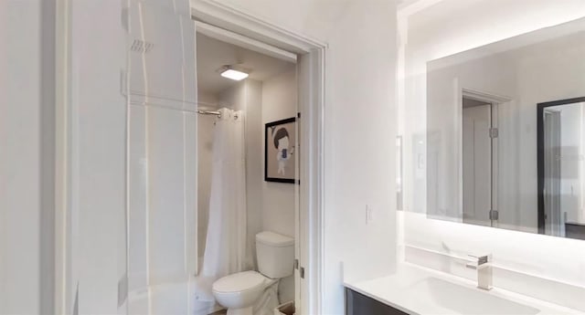 14501 Grove Resort Ave Unit 2440, Winter Garden, FL 34787 - bathroom featuring toilet, vanity, and shower / bath combo with shower curtain