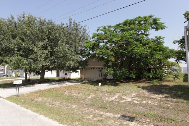 2305 Rio Grande Forest Ln, Kissimmee, FL 34759 - obstructed view of property with a garage and driveway