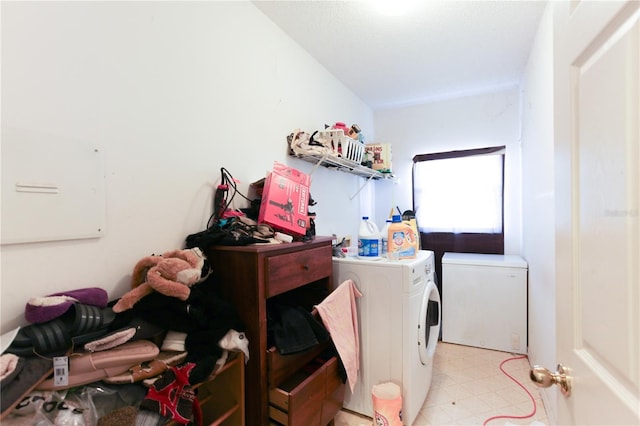 2305 Rio Grande Forest Ln, Kissimmee, FL 34759 - laundry room featuring washer and dryer and light floors