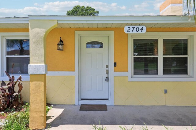 2704 Yule Tree Dr, Edgewater, FL 32141 - property entrance with stucco siding