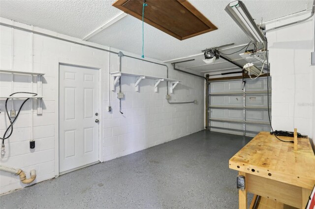 2704 Yule Tree Dr, Edgewater, FL 32141 - garage with concrete block wall and a garage door opener