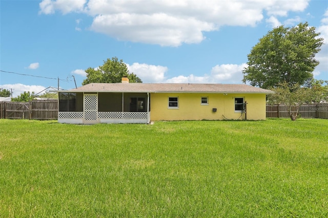 2704 Yule Tree Dr, Edgewater, FL 32141 - back of house with a sunroom and stucco siding