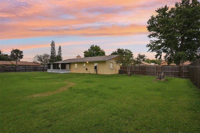 2704 Yule Tree Dr, Edgewater, FL 32141 - view of yard featuring a sunroom and central AC unit