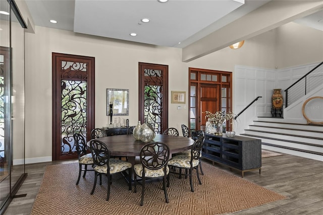 1112 Preserve Point Dr, Winter Park, FL 32789 - dining room featuring wood finished floors, stairway, recessed lighting, baseboards, and a high ceiling