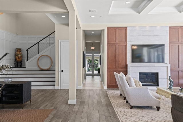 1112 Preserve Point Dr, Winter Park, FL 32789 - living area with stairway, wood finished floors, a decorative wall, a glass covered fireplace, and recessed lighting