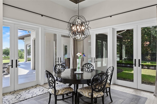 1112 Preserve Point Dr, Winter Park, FL 32789 - dining space with french doors and a chandelier