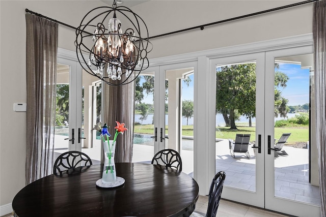 1112 Preserve Point Dr, Winter Park, FL 32789 - dining space with french doors, a water view, and healthy amount of natural light