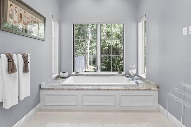 1112 Preserve Point Dr, Winter Park, FL 32789 - bathroom with a bath, tile patterned flooring, and baseboards