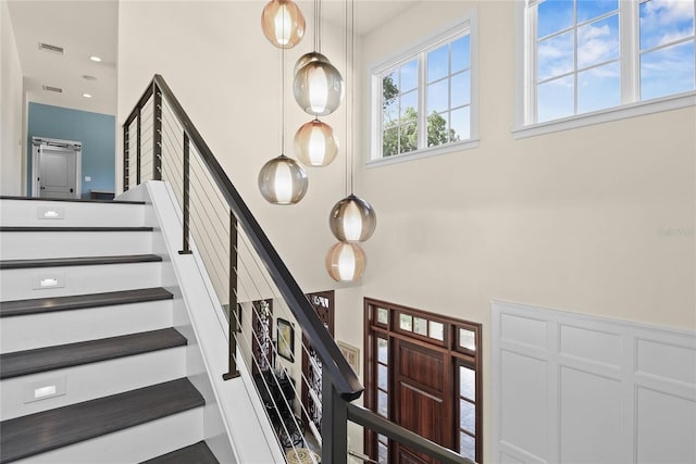 1112 Preserve Point Dr, Winter Park, FL 32789 - staircase featuring a high ceiling and recessed lighting