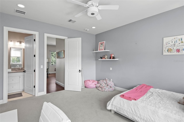 1112 Preserve Point Dr, Winter Park, FL 32789 - carpeted bedroom featuring baseboards, connected bathroom, a sink, recessed lighting, and ceiling fan
