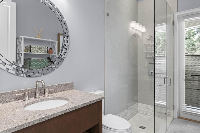 1112 Preserve Point Dr, Winter Park, FL 32789 - bathroom featuring toilet, vanity, a shower stall, and tile patterned floors