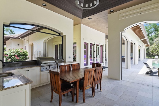 1112 Preserve Point Dr, Winter Park, FL 32789 - view of patio featuring french doors, a sink, outdoor dining space, and an outdoor pool