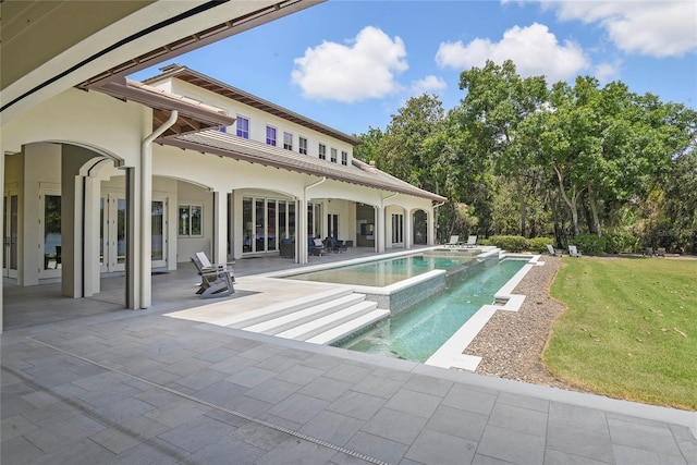 1112 Preserve Point Dr, Winter Park, FL 32789 - view of pool with a patio, a lawn, a pool with connected hot tub, and french doors
