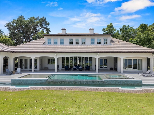 1112 Preserve Point Dr, Winter Park, FL 32789 - back of house with a pool with connected hot tub, a yard, and a patio