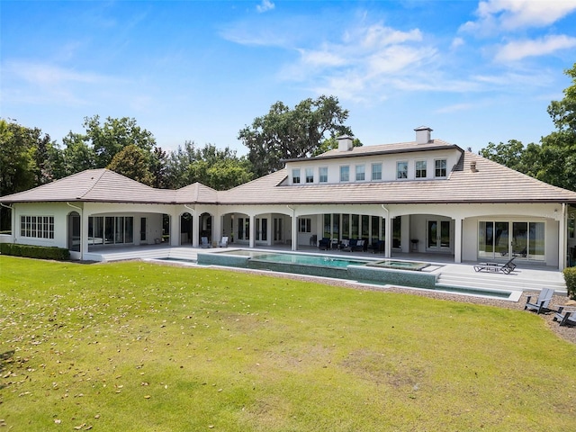 1112 Preserve Point Dr, Winter Park, FL 32789 - back of property featuring a chimney, a yard, a patio area, and a pool with connected hot tub