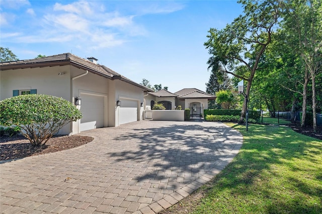 1112 Preserve Point Dr, Winter Park, FL 32789 - view of front of home featuring an attached garage, decorative driveway, and stucco siding