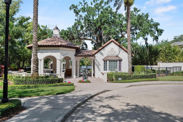 1112 Preserve Point Dr, Winter Park, FL 32789 - mediterranean / spanish house with stucco siding and a tiled roof