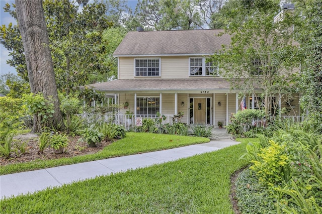 2132 Palm Vista Dr, Apopka, FL 32712 - view of front of house with a front yard and covered porch