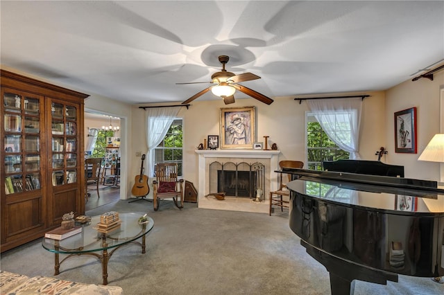 2132 Palm Vista Dr, Apopka, FL 32712 - carpeted living area featuring a fireplace with raised hearth and a ceiling fan