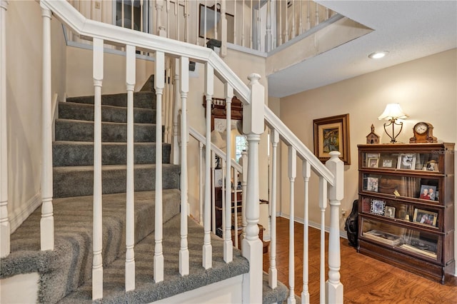 2132 Palm Vista Dr, Apopka, FL 32712 - staircase featuring wood finished floors and recessed lighting