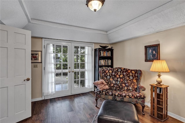 2132 Palm Vista Dr, Apopka, FL 32712 - sitting room with french doors, wood finished floors, a textured ceiling, and baseboards