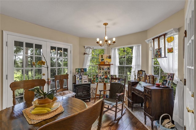 2132 Palm Vista Dr, Apopka, FL 32712 - dining area featuring a chandelier and hardwood / wood-style floors