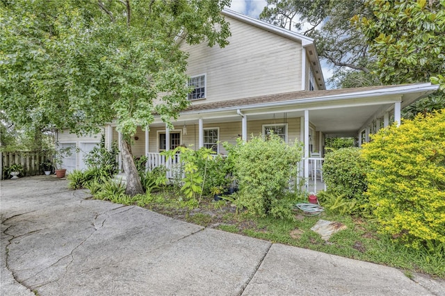 2132 Palm Vista Dr, Apopka, FL 32712 - view of front facade featuring a porch, driveway, and an attached garage