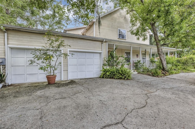 2132 Palm Vista Dr, Apopka, FL 32712 - view of front facade featuring covered porch, asphalt driveway, and an attached garage