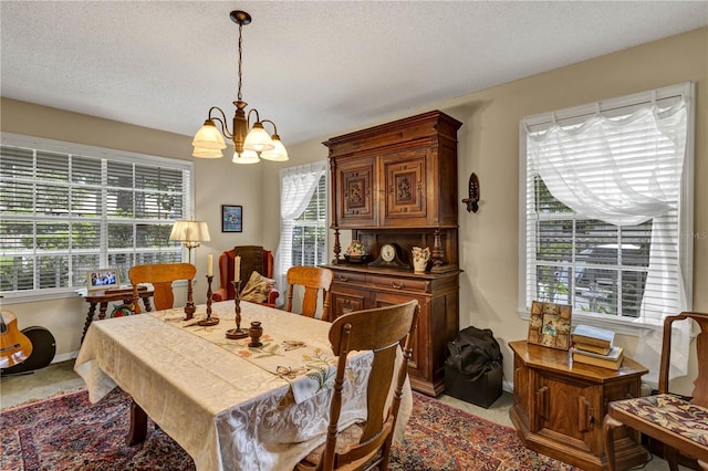 2132 Palm Vista Dr, Apopka, FL 32712 - dining room with a chandelier, carpet floors, and a textured ceiling