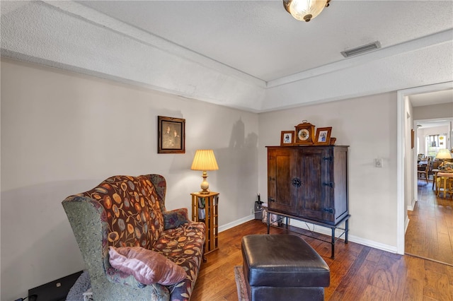 2132 Palm Vista Dr, Apopka, FL 32712 - sitting room featuring wood-type flooring, baseboards, and a textured ceiling