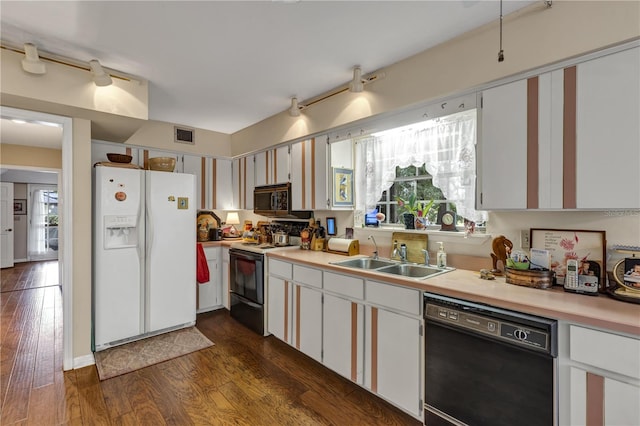 2132 Palm Vista Dr, Apopka, FL 32712 - kitchen featuring white refrigerator with ice dispenser, black dishwasher, electric stove, a sink, and light countertops