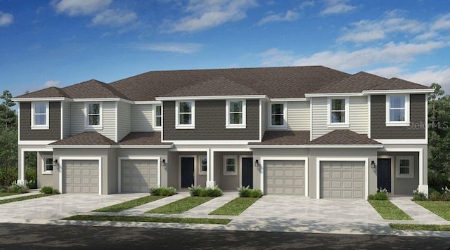130 River Front Way, Edgewater, FL 32141 - multi unit property with a garage, driveway, roof with shingles, and stucco siding