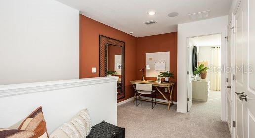 130 River Front Way, Edgewater, FL 32141 - corridor with carpet flooring and an office area