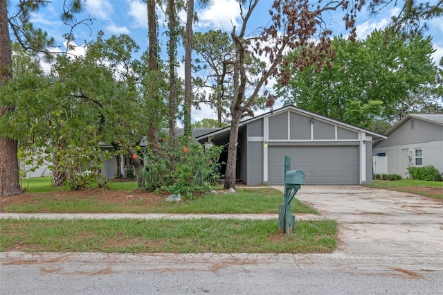 885 Little Bend Rd, Altamonte Springs, FL 32714 - mid-century home featuring a garage and driveway