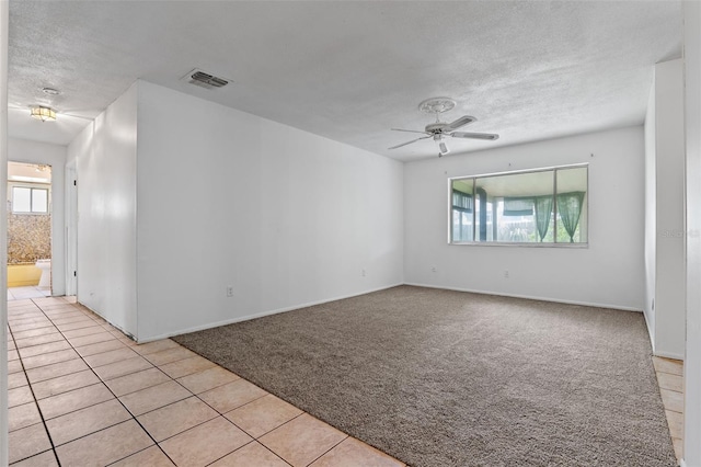 885 Little Bend Rd, Altamonte Springs, FL 32714 - spare room with healthy amount of natural light, a textured ceiling, light colored carpet, and a ceiling fan